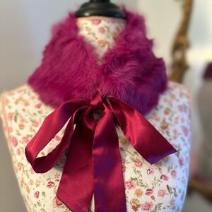 Fuchsia pink woman’s rabbit collar with fuchsia satin ties.